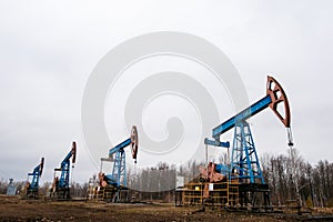 Green Oil pump oil rig energy industrial machine for petroleum crude. oil crisis. Russia pumps oil pollution