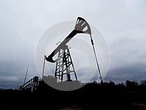 Green Oil pump oil rig energy industrial machine for petroleum crude. oil crisis. Russia pumps oil pollution