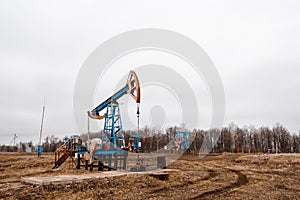 Green Oil pump oil rig energy industrial machine for petroleum crude. oil crisis. Russia pumps oil pollution