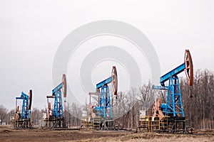 Green Oil pump oil rig energy industrial machine for petroleum crude. oil crisis. Russia pumps oil pollution.