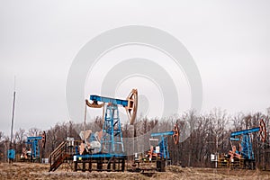 Green Oil pump oil rig energy industrial machine for petroleum crude. oil crisis. Russia pumps oil pollution.