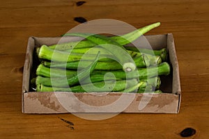 Green okra inside the box