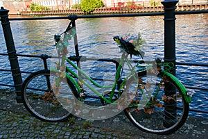 a green old bike turned into artwork photo