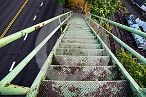 Green old rusted stairs going down