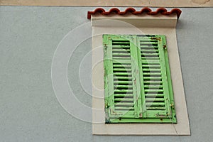 Green Old Window on a Grey wall