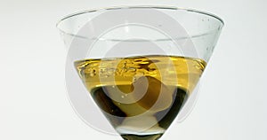 Green Olive, olea europaea, Falling into a Glass of Vermouth,