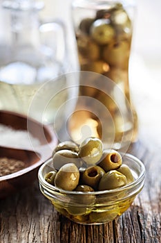 Green olives in a glass bowl