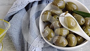 Green olives and olive oil, healthy eating ingredients