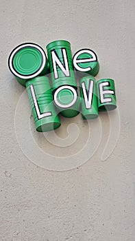 Green one love sign on building