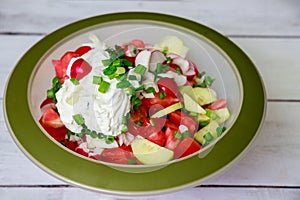 Green onion, radish and tomato in healthy salad.