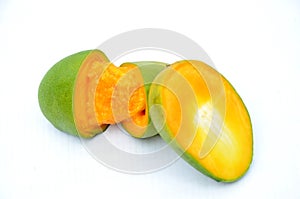 The green orenge slice half cutt mango isolated on white background