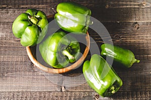 green organic paprika on wooden bowl/Fresh green organic paprika