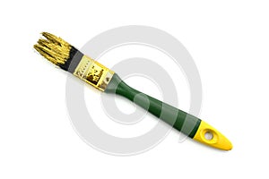 Green paintbrush with dried gold color stain and size number on shiny metallic brass ferrule