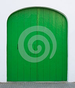 Green painted door with hatch