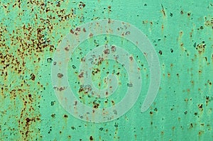 Green painted grunge metal surface