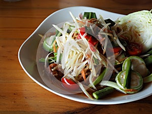 Green papaya salad with pickled mussels