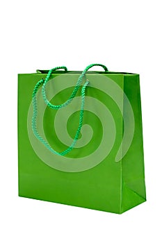 Green paper bag isolated on white background