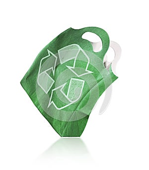 Green paper bag with rsymbol of recycling isolated on a white background
