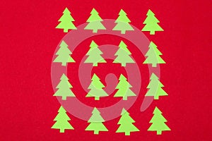 Green paper little christmas trees, ornaments for Christmas celebration