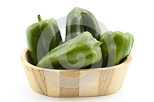 Green paprikas in container