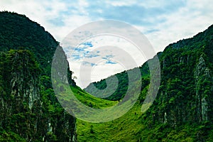 green passage between two mountain