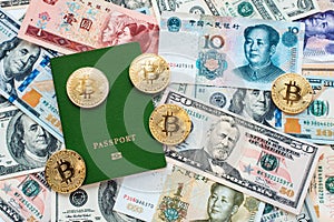 Green passport on background, proof of identity. Against paper money, US dollars, Chinese yuan CNY, metal coins, bitcoin
