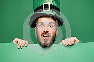 Green patricks background. Man in Patrick's suit smiling. photo