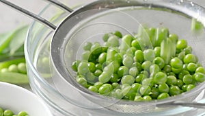 Green pea bounce off a colander