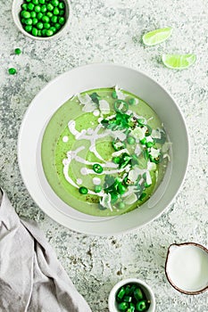 Green pea cream soup with parsley and lime