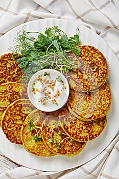 Green pea and oatmeal pancakes on a plate