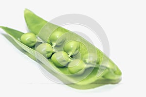 Green pea pod, green peas, white background, close up