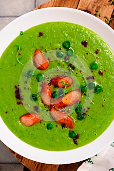 Green pea soup with sausages.style hugge.selective focus