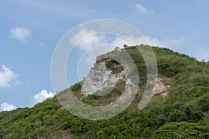 Green peak Cut against the blue sky