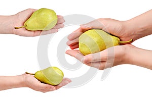 Green pear isolated on white background in woman hands