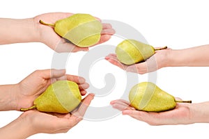 Green pear isolated on white background in woman hands