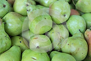 Green pears for sale at city market