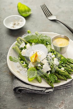 Green peas and asparagus with poached egg