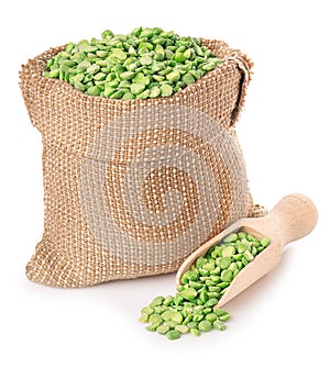 Green peas in bag with scoop isolated on white