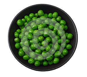 Green peas in black bowl isolated on white background. top view