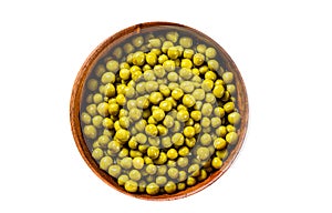 Green peas in a bowl. Canned food. Isolated on white background.