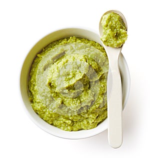 Green peas and broccoli baby puree on white