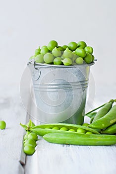 Green peas in a bucket photo