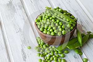 Green peas in a ceramic bowl photo
