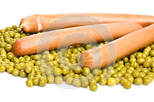 Green peas with frankfurter close up