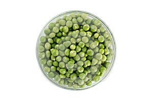 Green peas in a glass bowl. top view