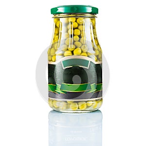 Green peas in a glass jar. Tinned green peas. Glass isolate.