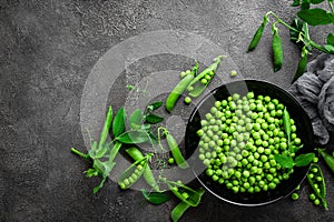 Green peas with pods and leaves photo