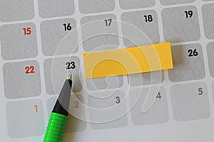 Green pen points to a Twenty-three number of calendar and have b