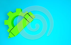 Green Pencil and gear icon isolated on blue background. Creative development. Blogging or copywriting concept