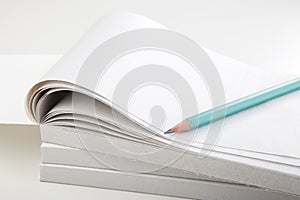 Green Pencil and Notebook